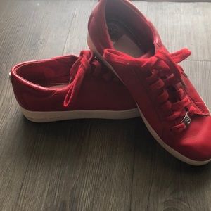 Michael Kors red leather sneakers.